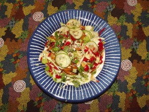 Lettuce, pointy cabbage, tomatoes, cucumber, basil, Greek basil, sorrel, parsley, mixed seeds, roasted cashew nuts, roast peppers and tomatoes, sweet peppers, Greek olive oil
