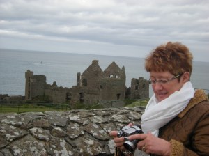 Elly at Dunluce Castle, with a slopey sea!